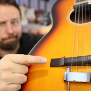 This Guitar has a RUBBER Bridge...and it Sounds AMAZING!
